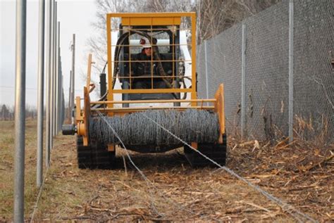 barb wire roller for skid steer|barbed wire mount.